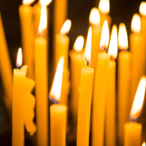 A group of glowing yellow candles.