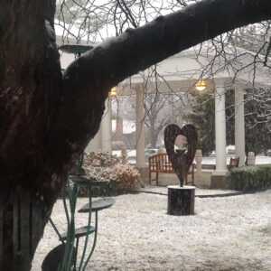 A heart sculpture in the snow-covered courtyard of All Souls Unitarian Church.