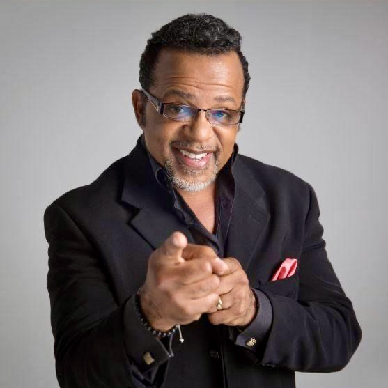 Bishop Carlton D. Pearson grinning and pointing at the camera