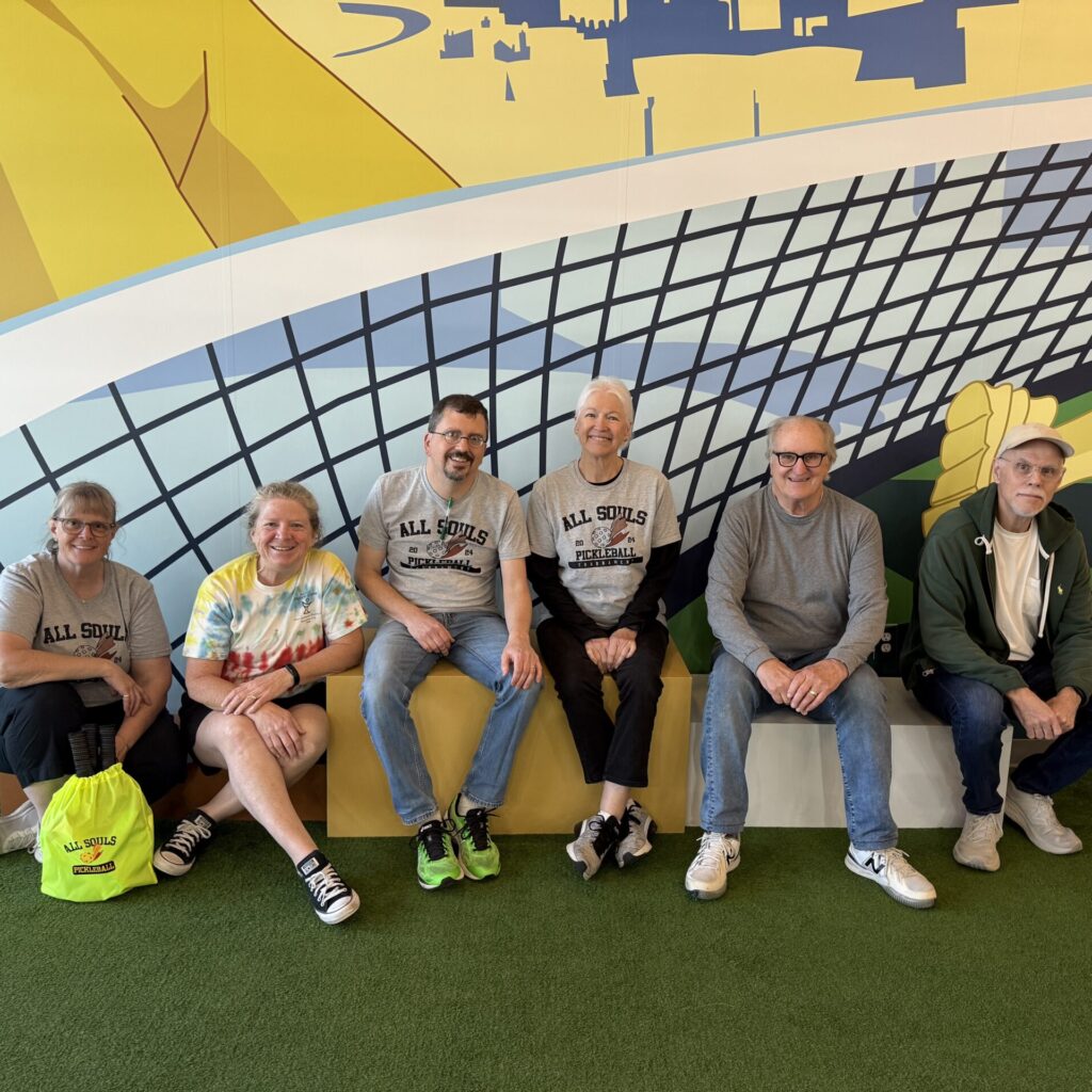 Six members of the All Souls Pickleball commitee smiling after the 2025 fundraiser.